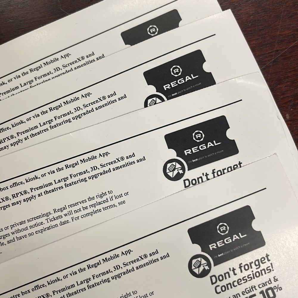 Four regal premiere movie tickets.